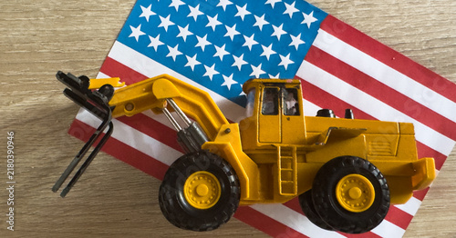 Cuadro en lienzo toy excavator and flags of the USA