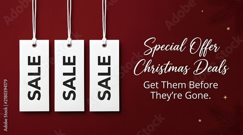 White sale tags hanging against a dark red background with christmas text promotion