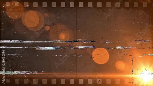 Vintage film strip overlay with scratches dust and warm light leaks retro film