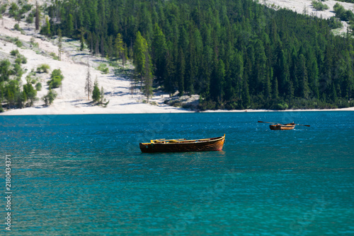 Quadro su tela Boats on the Braies Lake, Pragser Wildsee in Dolomites mountains, Sudtirol, Ital