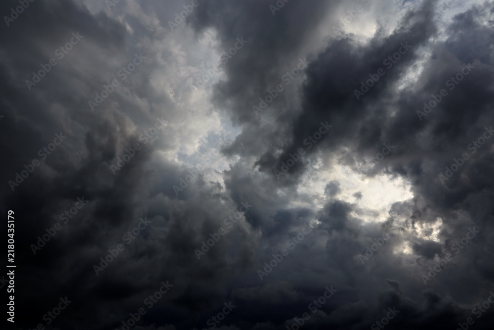 Obraz premium dramatic dark clouds in the sky, dark storm clouds in a dark sky before rain,beautiful landscape with cloudy sky 