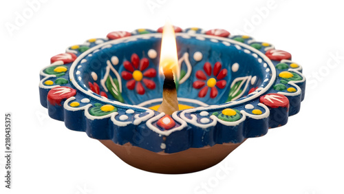 A decorative traditional indian clay diya lamp glowing isolated on transparent background