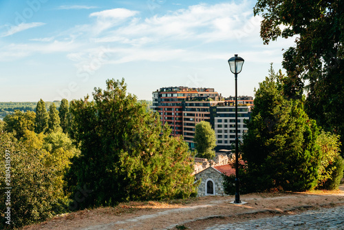Cuadro en lienzo Modern residential buildings rise beyond trees and historic grounds near Kalemegdan in Belgrade
