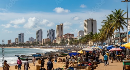 Busy coastal market with people and palm trees.