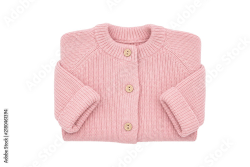 Bild auf Leinwand Beautifully folded pink knitted baby cardigan with wooden buttons, showcasing it