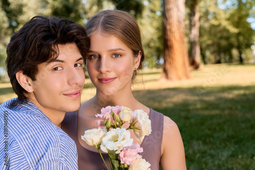 Canvas Print Young lovers share a delightful moment surrounded by nature