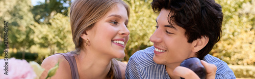 Canvas Print A happy couple enjoys a blissful day in a sunny green park, surrounded by nature