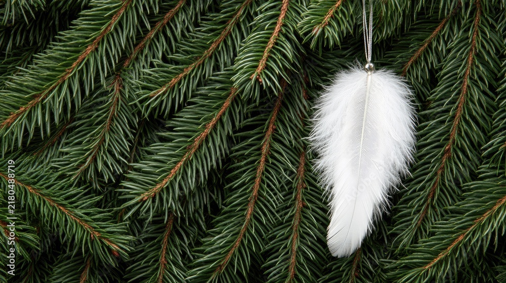 Fototapeta premium Delicate white angel wings gently suspended from an evergreen tree create a whimsical touch to the holiday atmosphere