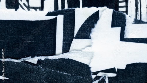An abstract dynamic motion background featuring a high contrast collage of ripped torn paper layers with bold black and white geometric shapes and raw textured edges for frame animation.