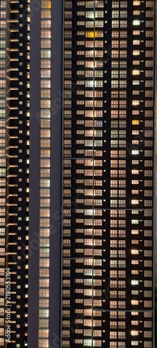 Fotografía Detailed model of a residential buildings with numerous illuminated windows arranged in a grid