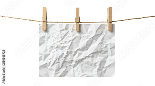 Принти на полотні White crumpled paper sheet hanging from a sturdy brown rope using three classic