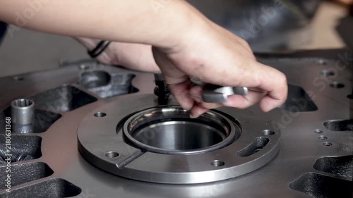 Mechanic Hands Tightening Flange Bolt Using Open End Spanner Wrench.