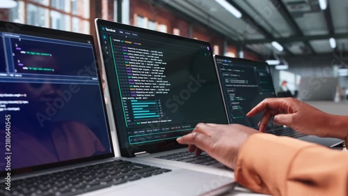 Software Developer Works Carefully On Laptop