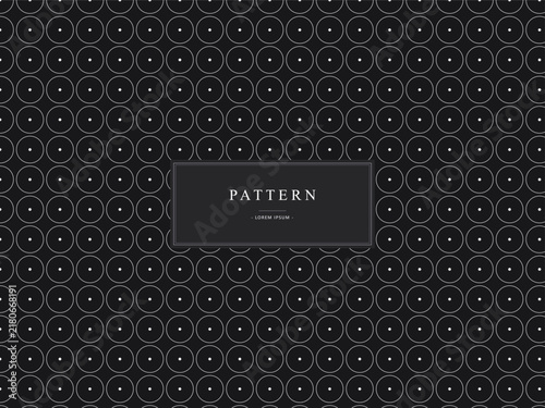 Minimalist geometric circle pattern background with thin white lines on dark gray surface