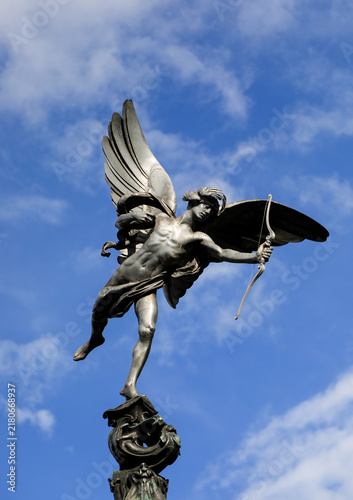 Shaftesbury Memorial Fountain statue of Anteros known as Eros in Piccadilly Circus London against blue sky