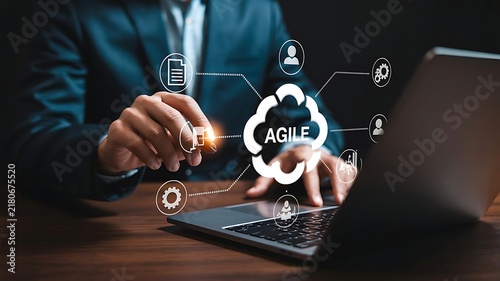 Professional Businessman Using Laptop with Agile Cloud Computing Digital Interface for Project Management and Business Strategy