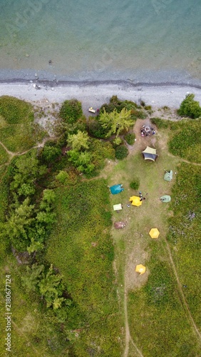 Aerial view of tourist tent camp on the scenic lake coast