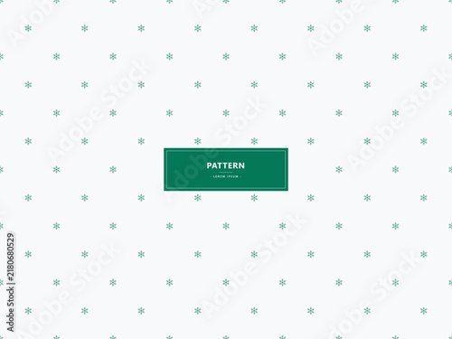 Minimalist green snowflake pattern on white background for winter holiday design