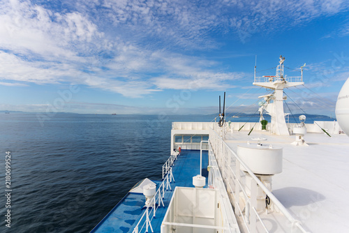 View of ferry sailing in calm seas with radar and communication equipment on deck