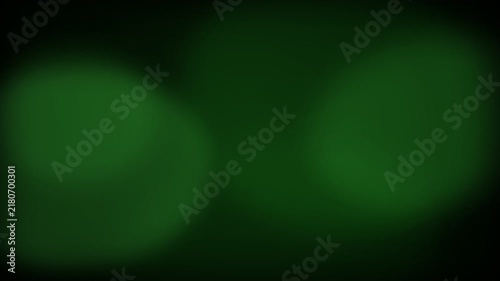 Abstract dark green background with soft out of focus light circles