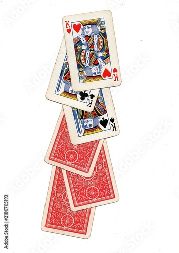 A hand of vintage playing cards isolated on a white background.