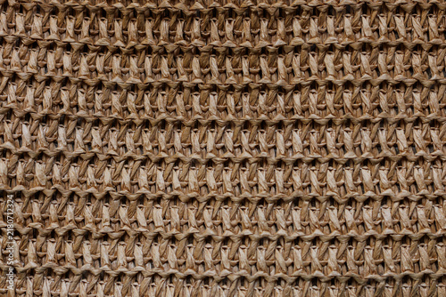 Фотография Natural raffia crochet woven textile texture close up