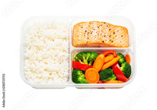 Delicious salmon fillet with fluffy white rice and vibrant steamed vegetables including broccoli carrots and peppers in a bento lunch box.