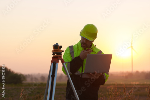 Civil engineers inspect wind farms, power generation systems, natural industry and environmental concepts, clean energy