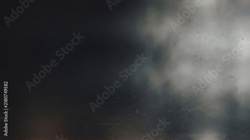 Abstract dark background with soft white light glowing from the right side