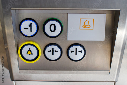 Elevator Control Panel with Floor Buttons and Emergency Call Bell Icon