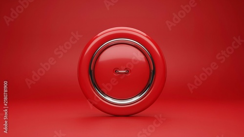Close up of a vibrant red button with chrome edging studio lighting minimalist product shot