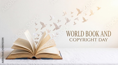 Open book releasing flock of paper birds against light background