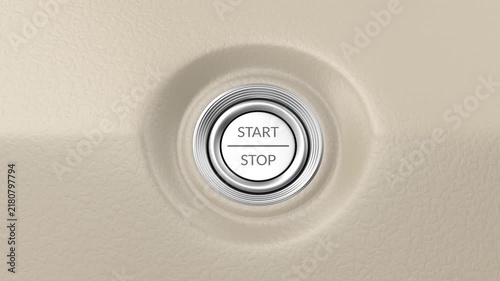 Pressing the start-stop button on a beige car dashboard