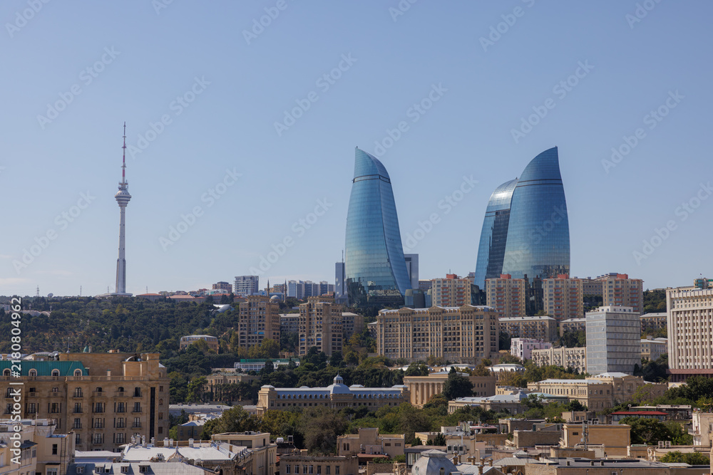 Fototapeta premium Skyline view of modern architecture in Baku, revealing the beauty of the Flame Towers and television tower