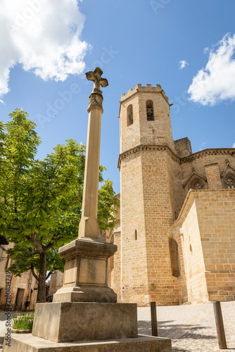 stone pillory with a cross in front of the church of Santa Maria la Mayor in Valderrobres, Comarca of Matarrana, province of Teruel, Aragon, Spain