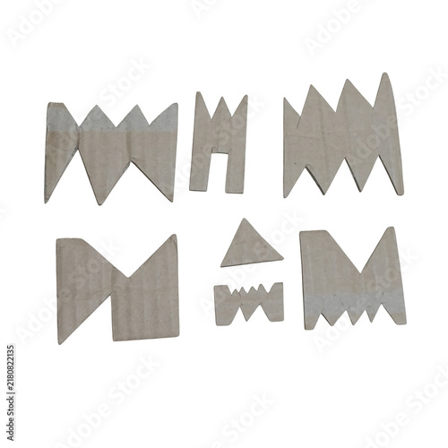 Foto White serrated edged letters spelling wham on black background, white letters