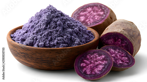 Filipino ube purple yam powder with sliced fresh tubers in a bowl. Natural ingredient for desserts, beverages, baking, flavoring, and antioxidant-rich food products.