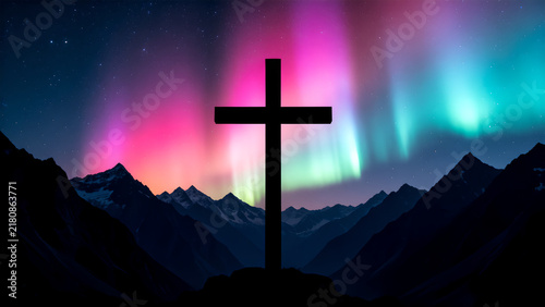 Christian cross silhouette standing against vibrant aurora borealis and starry night mountain landscape.