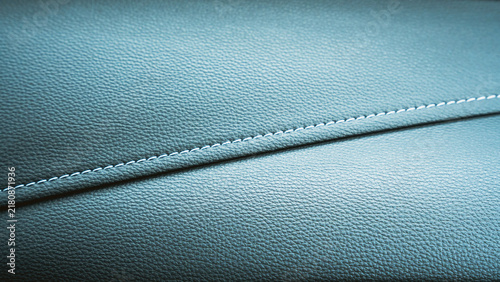 Obraz na plátně Close up of stitched blue leather upholstery showing fine texture and seam detai