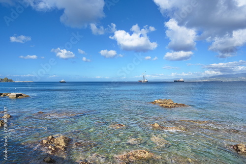 Clear Coastal Waters and Distant Ships in Milazzo, Sicily