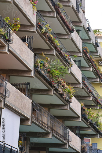 Layered Balconies with Potted Plants in Milazzo, Sicily
