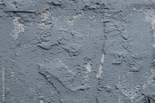 Fotografía A rough gray wall with an uneven layer of putty as a background