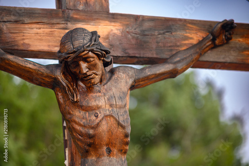 Принти на полотні A wooden crucifix with Jesus Christ on Mount Podbrdo, the Apparition Hill overlooking the village of Medjugorje, Bosnia and Herzegovina