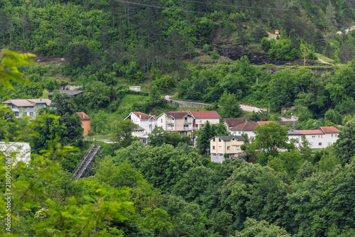 Small Hillside Village Houses Nestled in Lush Green Forest Landscape With Residential Homes and Trees, Jablanica, Bosnia And Herzegovina