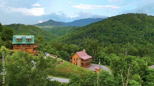 Beautiful homes in Gatlinburg, Tennessee nestled in the Great Smoky Mountains with scenic forest landscape and summer colors