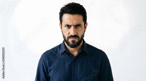 Man with Angry Expression and Dark Beard.