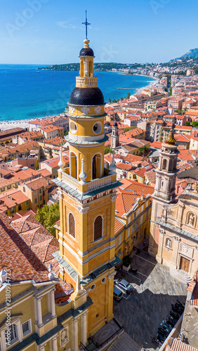 Aerial drone view of the Basilica of Saint-Michel in the old town of Menton on the coast of the Mediterranean Sea in the French Riviera