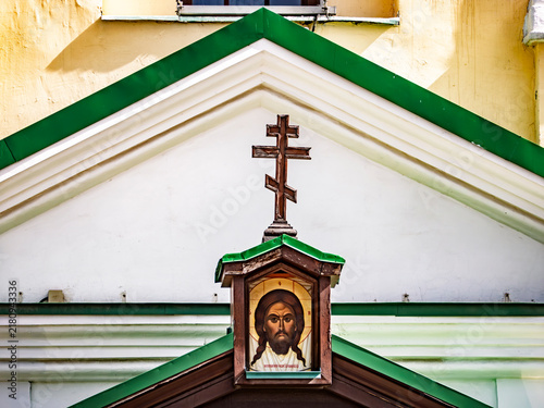 Bild auf Leinwand Orthodox Christian icon of Jesus Christ with a cross on top of a church wall