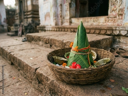 Sacred Offering Basket With Banana Leaf Cone And Flowers Outdoors