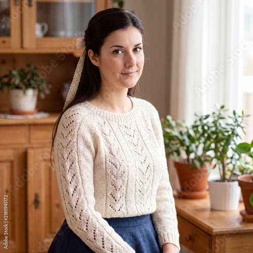 Bild auf Leinwand Portrait of a beautiful young woman in woolen knitted clothes